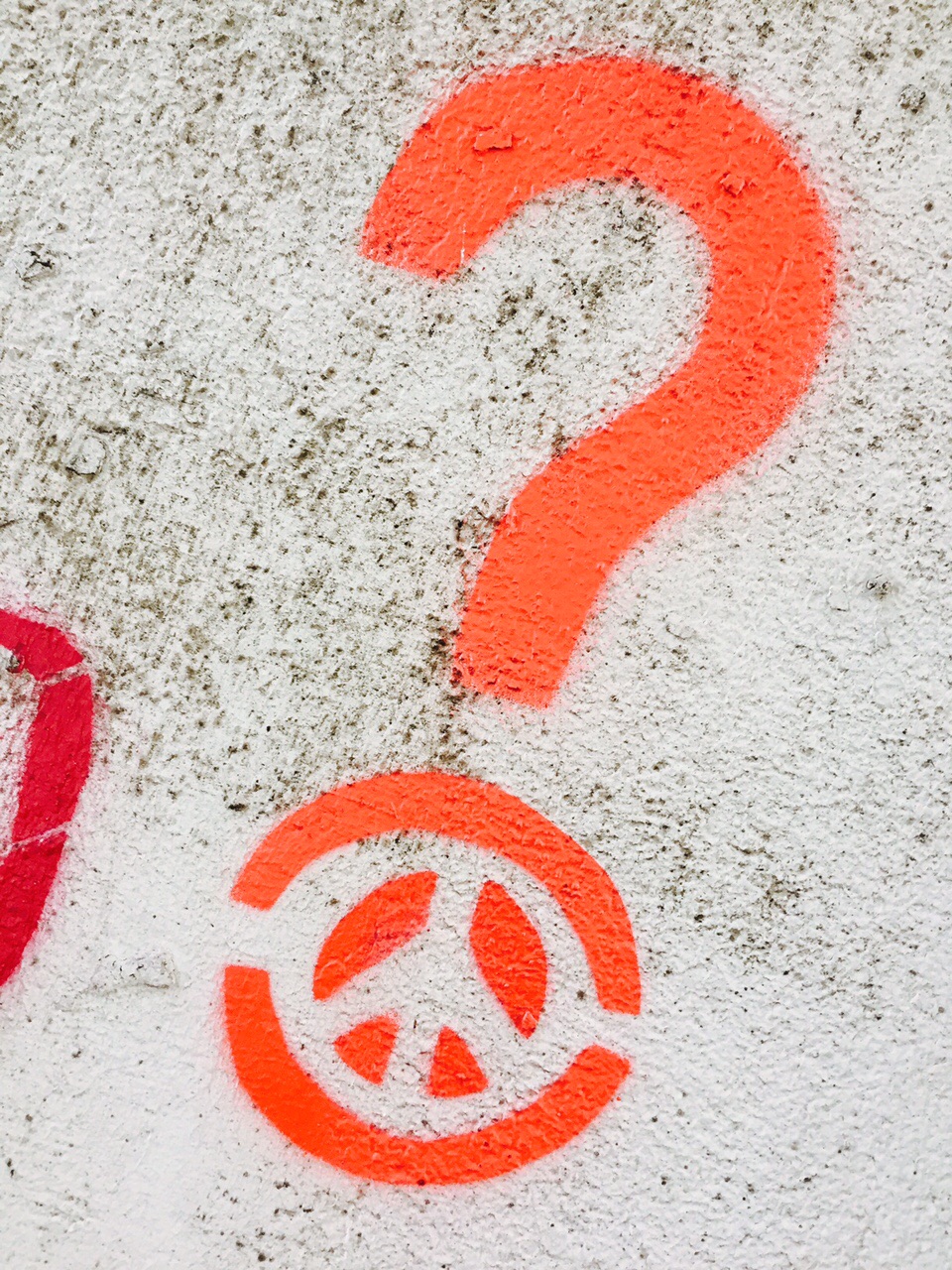 Peace sign with question mark art on the streets