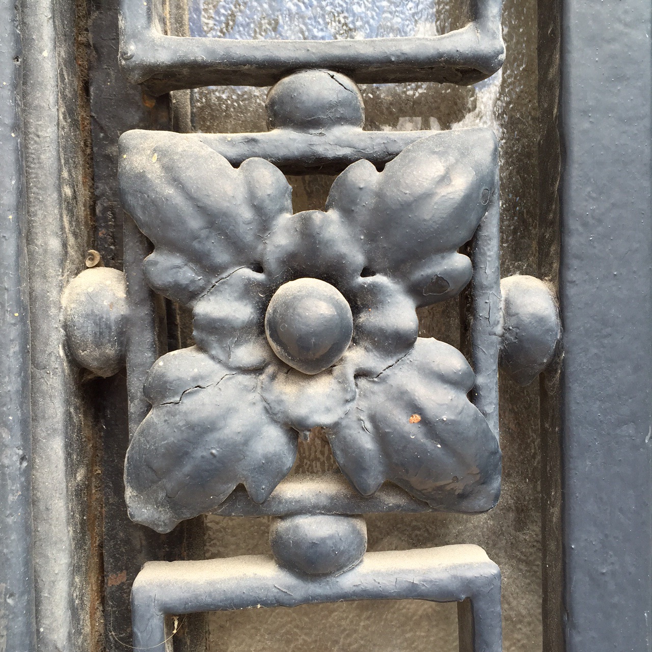 Flower motif is featured in this ironwork.  