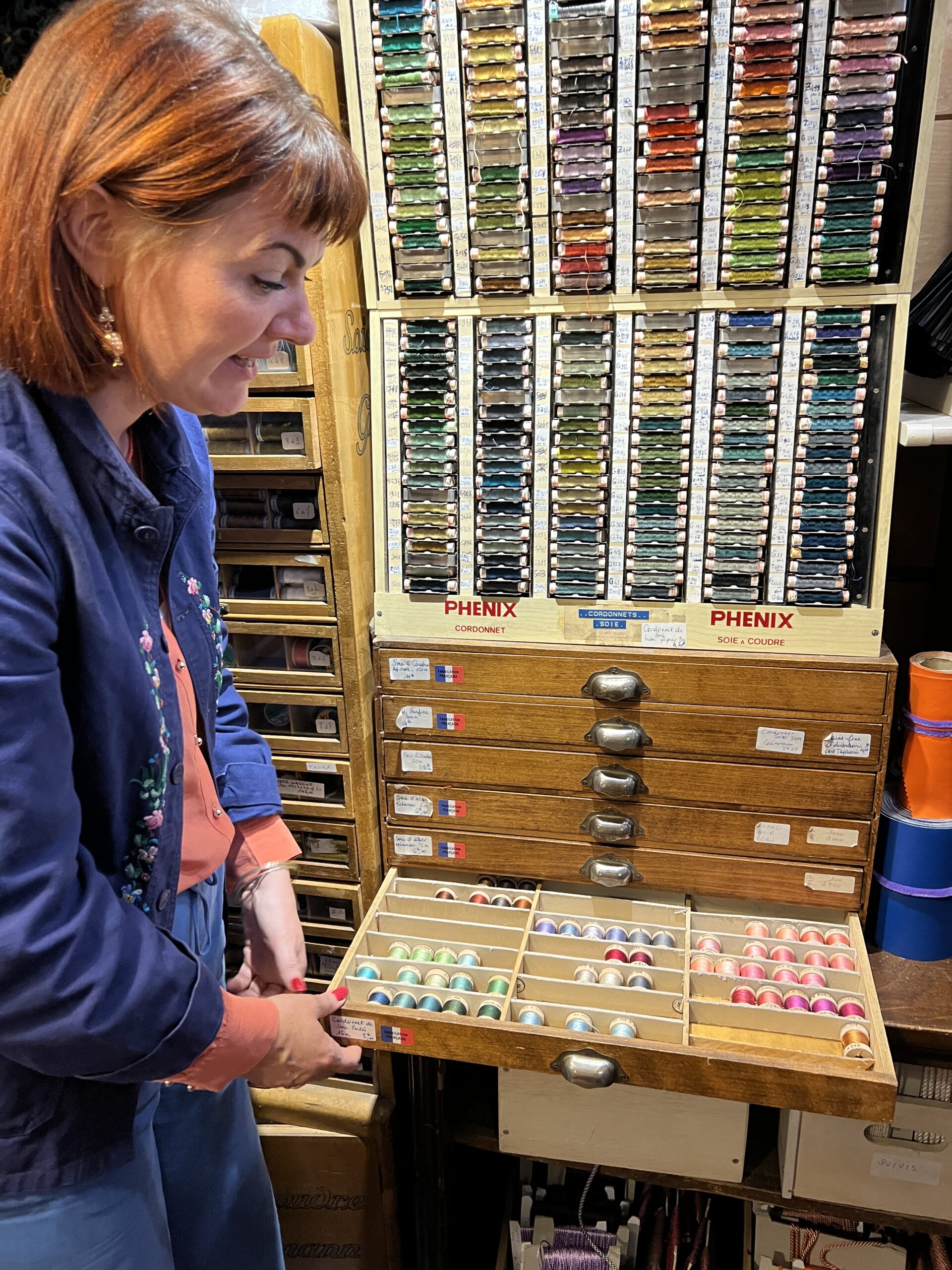 Our guide Rebecca showing us threads at AuVer a Soie